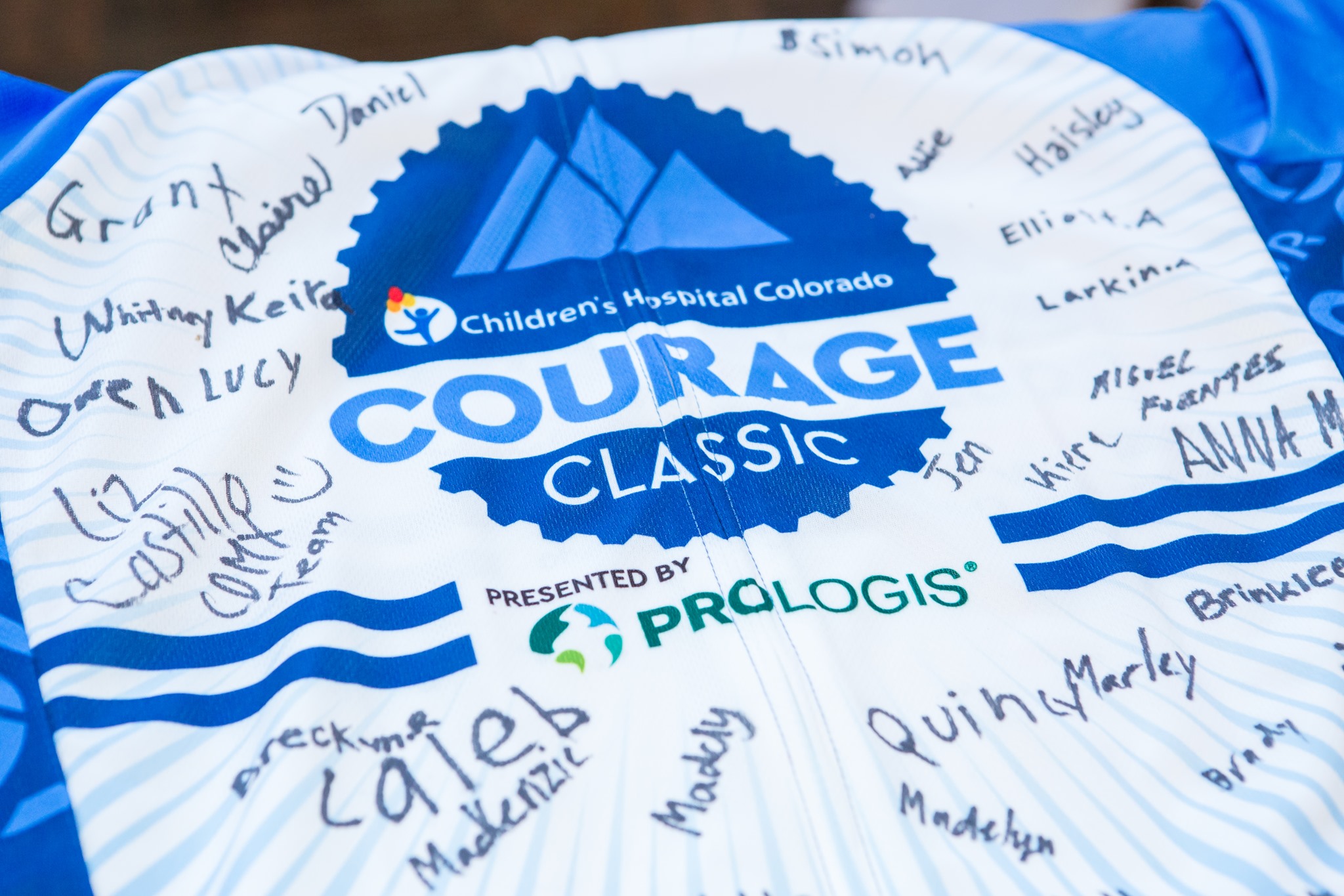 Blue and white Courage Classic jersey crowded with inspiring signatures in ink from supporters