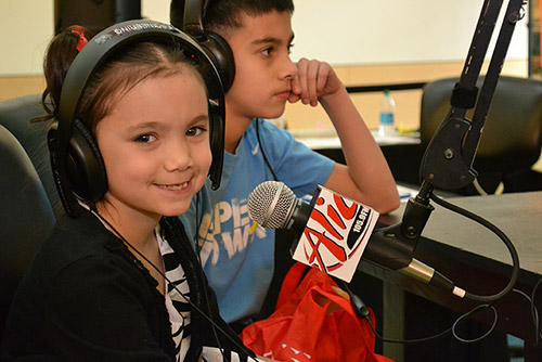 little girl at a microphone