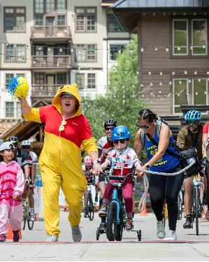 Forest, Children's Hospital Colorado patient crossing the finish line at the 2024 Courage Classic