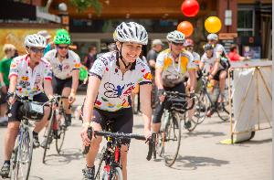 Here we are in 2018 being led at the finish by Dr. Christie Osborne of Children's Hospital whose smile tells it all. :)