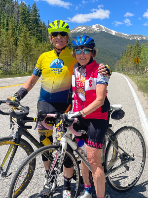 John and Celia riding up Loveland Pass