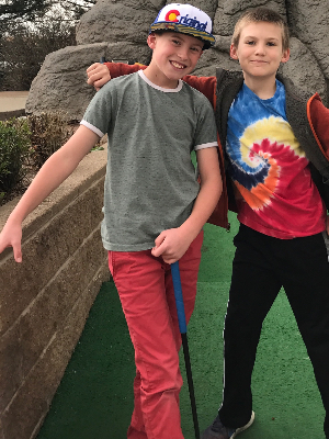 Theo with his cousin at mini golf