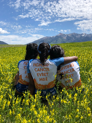 Reflecting in canola fields in Montana during Texas 4000 bike ride