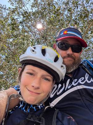 Alex and Dad enjoying some shade at the Vail Pass Rest Station.
