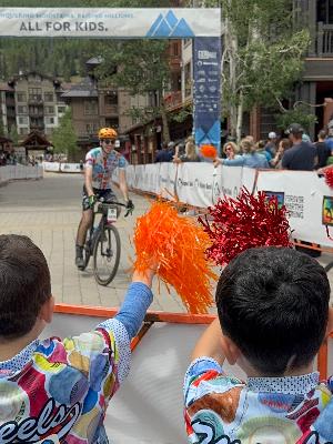 Crossing the finish line with our kids cheering me on 2025